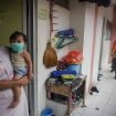 Petugas Dinas Lingkungan Hidup (DLH) Solo menyemprotkan cairan disinfektan di Rusunawa Semanggi, Solo, Jawa Tengah, Rabu (18/3/2020).